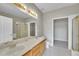 Bright bathroom features a dual sink vanity, shower, and separate commode area at 14333 E Napa Pl # 5D, Aurora, CO 80014