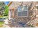 Stone clad entrance featuring steps, a storm drain and manicured landscaping at 14333 E Napa Pl # 5D, Aurora, CO 80014