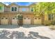 Townhome featuring 4 garage doors at 14333 E Napa Pl # 5D, Aurora, CO 80014