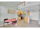 Kitchen area with a view of the second floor, dining area, stainless appliances, and wooden cabinets at 14333 E Napa Pl # 5D, Aurora, CO 80014