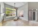 Bright living room featuring high ceilings, large windows, neutral color palette, and tiled floors at 14333 E Napa Pl # 5D, Aurora, CO 80014