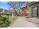 Spacious backyard featuring a well-maintained lawn, wood fence, patio area, and mature landscaping at 1545 Steele St, Denver, CO 80206