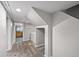 Basement hallway leading to a utility area, laundry and room at 1545 Steele St, Denver, CO 80206
