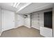 Finished basement featuring neutral carpeting, ample storage, and bonus space for exercise or recreation at 1545 Steele St, Denver, CO 80206