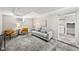 Finished basement featuring a seating area, and laundry room in background at 1545 Steele St, Denver, CO 80206