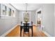 Dining room features hardwood floors, natural light, and classic finishes at 1545 Steele St, Denver, CO 80206