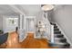 Welcoming foyer features hardwood floors and staircase to the upper level at 1545 Steele St, Denver, CO 80206