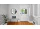 Bright entryway features hardwood floors, stylish decor, and lots of natural light at 1545 Steele St, Denver, CO 80206