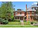 Charming home with a well-maintained lawn and inviting curb appeal at 1545 Steele St, Denver, CO 80206