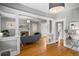 Open living area boasts hardwood floors, a fireplace, and elegant architectural details at 1545 Steele St, Denver, CO 80206