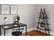 Stylish office space with a sleek desk, unique shelving, and decorative accents at 1545 Steele St, Denver, CO 80206