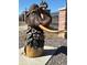 Eye-catching mammoth sculpture with floral accents, set in a landscaped outdoor area near a wrought iron fence at 7211 Dolores Ave, Frederick, CO 80530