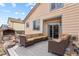 Back deck with outdoor seating and a brick oven, perfect for entertaining at 2957 W Rowland Ave, Littleton, CO 80120