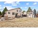 Spacious backyard with an outdoor patio and seating area, ideal for relaxation at 2957 W Rowland Ave, Littleton, CO 80120