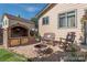 Outdoor patio with a custom brick grill and a cozy seating area for entertaining at 2957 W Rowland Ave, Littleton, CO 80120