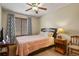 Bedroom with a ceiling fan, wood blinds and cozy decor at 2957 W Rowland Ave, Littleton, CO 80120