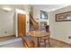 Open dining room adjacent to the staircase, complemented by stylish decor at 2957 W Rowland Ave, Littleton, CO 80120