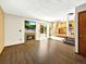 Bright and airy living room with a fireplace, modern furnishings, and an open floor plan to the kitchen at 2957 W Rowland Ave, Littleton, CO 80120