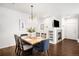 Bright dining room features a wood table, six chairs, and a fireplace at 6723 S Winnipeg Cir # 104, Aurora, CO 80016