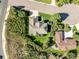 Birds-eye view of a home with green lawn and mature trees on a well-maintained lot at 228 Emerald Ct, Castle Rock, CO 80104