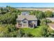 Aerial view of backyard featuring a patio, balcony, and expansive lawn at 228 Emerald Ct, Castle Rock, CO 80104