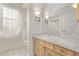 Bright bathroom with white tile, granite counters, vanity, and shower at 228 Emerald Ct, Castle Rock, CO 80104