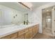 Bathroom featuring double sinks and access to shower and toilet area at 228 Emerald Ct, Castle Rock, CO 80104