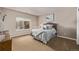 Comfortable bedroom featuring cozy carpet, a window, and neutral walls at 228 Emerald Ct, Castle Rock, CO 80104