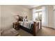 Bedroom featuring a decorative wooden bed frame, carpet, and a view from the window at 228 Emerald Ct, Castle Rock, CO 80104