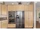 Kitchen boasting stainless steel refrigerator, double ovens, and custom cabinets at 228 Emerald Ct, Castle Rock, CO 80104