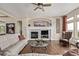 Bright living room featuring a fireplace, hardwood floors, and plenty of natural light at 228 Emerald Ct, Castle Rock, CO 80104