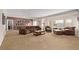 Spacious living room featuring carpet, leather furniture, and neutral color paint at 228 Emerald Ct, Castle Rock, CO 80104