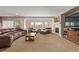 Spacious living room with a fireplace, windows with blinds, and carpet at 228 Emerald Ct, Castle Rock, CO 80104