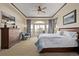 Bright main bedroom with a seating area, a sliding glass door and dresser at 228 Emerald Ct, Castle Rock, CO 80104