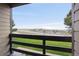 The balcony view shows a highway in the distance, along with a lush green lawn and trees at 579 Wright St # 204, Lakewood, CO 80228
