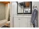 Modern bathroom with tub and shower combo, vanity, and towel rack at 579 Wright St # 204, Lakewood, CO 80228