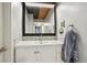 Bathroom vanity with tiled backsplash, vessel sink, and modern fixtures at 579 Wright St # 204, Lakewood, CO 80228