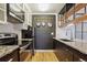 Stylish kitchen features granite counters, stainless appliances, and open shelving at 579 Wright St # 204, Lakewood, CO 80228