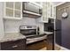 Updated kitchen with granite countertops and stainless steel appliances at 579 Wright St # 204, Lakewood, CO 80228