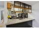 Well-lit kitchen with granite countertops, and stylish cabinetry at 579 Wright St # 204, Lakewood, CO 80228