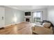 Bright living area with fireplace, TV and walk-out balcony at 579 Wright St # 204, Lakewood, CO 80228