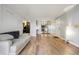 Open concept living room with wood flooring, neutral walls, and modern decor at 579 Wright St # 204, Lakewood, CO 80228