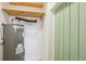 Utility room with a modern water heater and useful overhead storage at 579 Wright St # 204, Lakewood, CO 80228