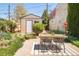 Backyard featuring a dining table and chairs and a shed at 3110 N Franklin St, Denver, CO 80205