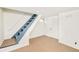 Basement features a set of stairs, painted walls and a carpeted floor at 3110 N Franklin St, Denver, CO 80205