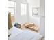 Cozy bedroom featuring two windows, cushions and neutral decorations at 3110 N Franklin St, Denver, CO 80205