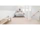 Bright bedroom features neutral carpet, a bed with many pillows, and lots of natural light at 3110 N Franklin St, Denver, CO 80205