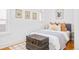 Cozy bedroom with antique trunk, hardwood floors, and neutral decor at 3110 N Franklin St, Denver, CO 80205