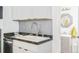 Laundry area with new sink, faucet, and white cabinets at 3110 N Franklin St, Denver, CO 80205