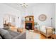 Bright living room featuring hardwood floors, a wooden fireplace, and modern furniture at 3110 N Franklin St, Denver, CO 80205